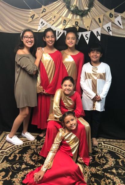 A picture of our young dance ministry when they presented during our church's anniversary week, and me -the leader- in the green dress!